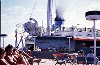 Passengers sunbathing on Games Deck, Pacific Ocean